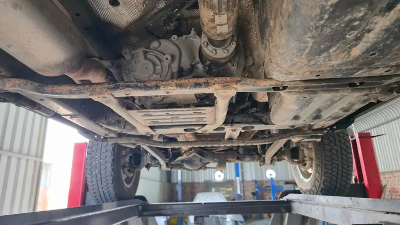 Front underbody and transfer case before treatment