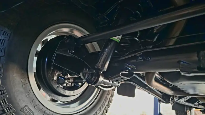 Rear coil seat, shock mount and panhard rod