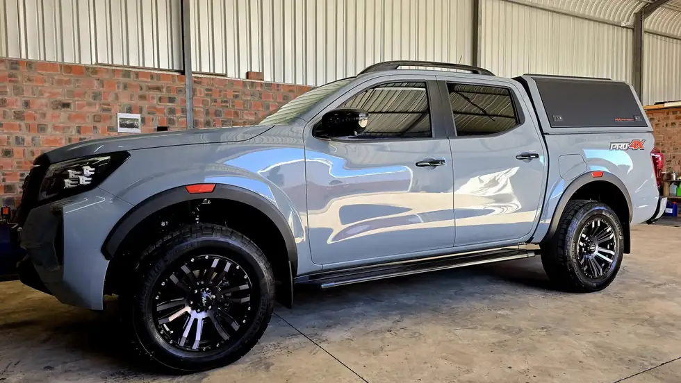 Grey Nissan Navara PRO-4X double cab with a canopy in the Anti-Rust workshop